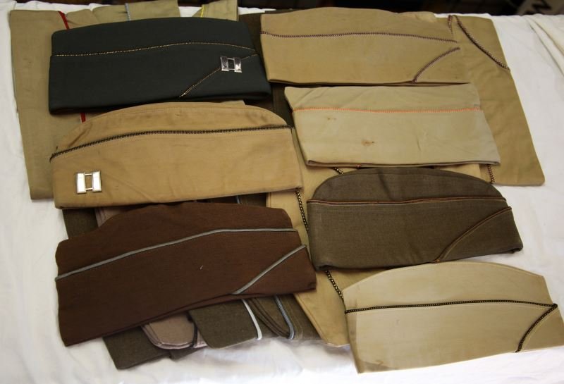 19 WWII U.S. ARMY GARRISON HATS W AIRBORNE & PARA: Varied collection with all being very good or better, includes 1951 WAC cap, Airborne wool OD green, 7 3/8, Infantry Paratrooper with patch and blue piping, 7 3/8, Armour piping cap with sterling Capt