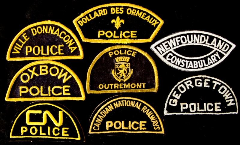8 CANADIAN POLICE PATCHES OXBOW OUTREMONT: Lot includes Georgetown Police, Police Outremont, Canadian National Railways Police, CN Police, Oxbow Police, Dollard Des Ormeaux Police, Ville Donnacona Police, and Newfoundland Constabulary patch. A