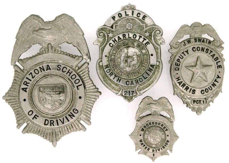 VINTAGE MIXED DIVISION POLICE BADGE LOT OF 4: Vintage mixed division police badge lot of four. To include: a Charlotte, NC police badge with state seal in middle numbered 217 (2.5 by 1.75 inches), a Woonsocket, RI water division badge numbered 1