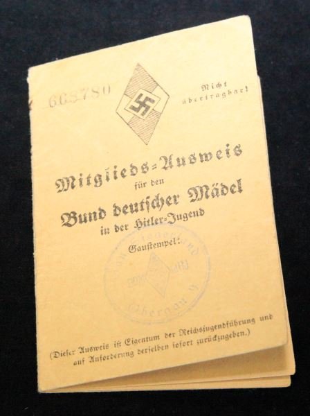 HITLER JUGEND (YOUTH) GIRL IDENTIFCATION BOOK: Book shows slight oxidation around staples on spine. Stamps and writing are still prominent. Spine is still holding. Overall in good to very good condition considering age. This lot has a reserve.