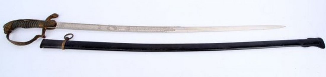 IMPERIAL LIONHEAD DOUBLE ENGRAVED CAVALRY SWORD: Red eyed lion head, shark skin grip, perfect in tight wire wrap, crossed swords on languet, engraved blade with eagle "MIT GOTT FUR KAISER AND REICH" on obverse is right side profile of Kaiser, blade 