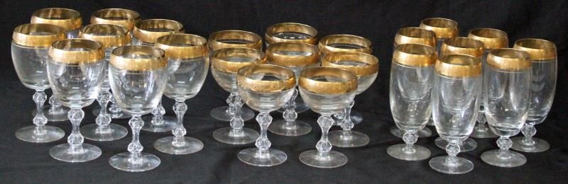 1930's MINTON 24K GOLD TRIM CRYSTAL GLASSWARE LOT: Minton 24K gold trim crystal glassware, 24 pieces total. Circa 1930's. Group includes: 8 water/beer goblets (6.75 inches tall), 8 large wine glasses (6.75 inches tall), and 8 champagne glasses (5.5 in