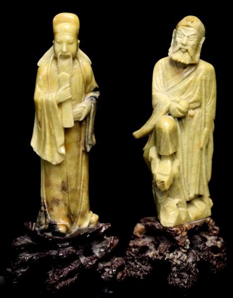 TWO INTRICATELY CARVED CHINESE SOAPSTONE FIGURINES: Two intricately carved Chinese soapstone figurines. One features the God of Prosperity measuring approximately 10 inches high. The other is a figure featuring a bearded man holding a staff and gourd m