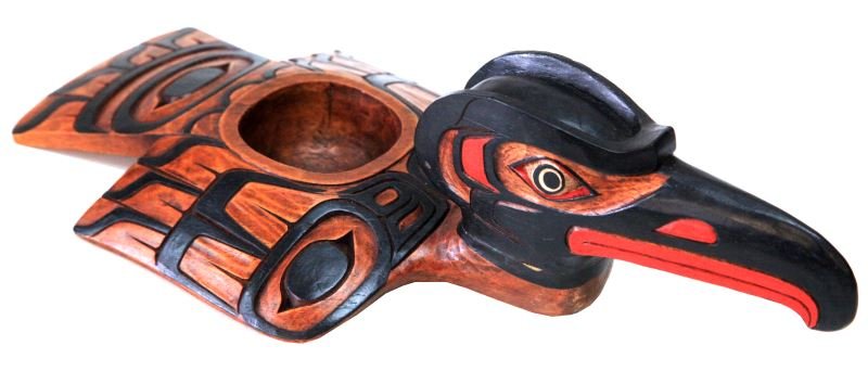 NORTHWEST COAST HAIDA TRIBE CARVED RAVEN WOOD BOWL: Northwest Coast Haida Tribe carved Raven wood bowl. This piece was used on special occasions to serve eulachon or seal oil. Measures at 16 inches in length and 8 inches wide. Bowl measures approximate