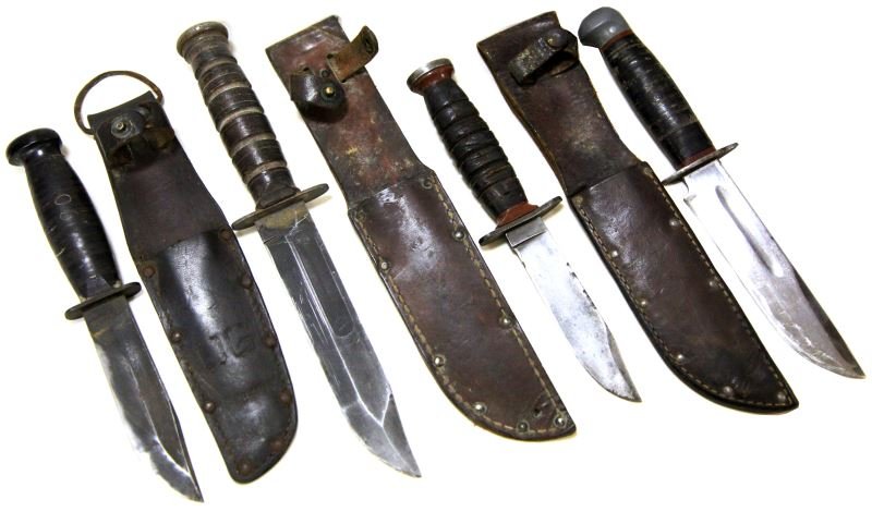 4 WWII FIGHTING KNIFE LOT USMC USN CAMILLUS PAL: Four knives, includes, USMC Camillus MK 2, without scabbard very good with clean original finish blade, RH Pal 36 MK 2, with scabbard, overall good with polished blade, Schrade Walden with scabbard, U