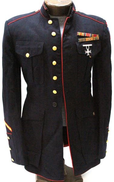 USMC DRESS BLUE TUNIC WITH ASSAULT BADGE 1939: QM stamped inside sleeve with M26739 in moth free condition. Approx. size 38. Barring two full service bars and USMC rifle sharpshooter badge. All button are present but collar EGA's are absent. 1st M