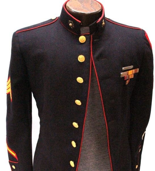 NAMED USMC WWII TUNIC WITH 5TH AMPHIBIOUS PATCHES: Named inside breast pocket to J. Zedialis and made by Ring & Brewer in Dallas,Texas. Small size. 5th amphibious corp. patch with red felt border. "In country" amphibious alligator patch (white) on lef