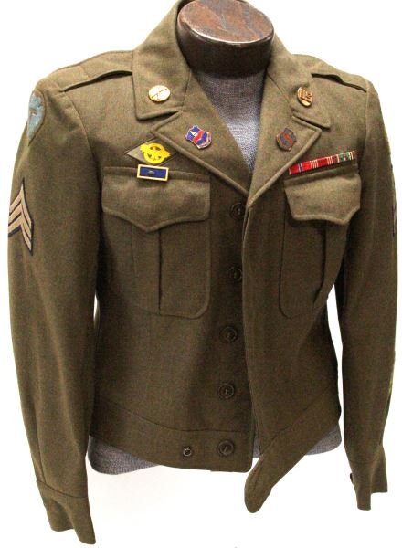 US ARMY "IKE" JACKET WITH PATCHES AND RIBBONS: U.S. Army waist coat "Ike" jacket in size 36S. In very good condition and having a "ruptured duck" patch to right breast. 3 Ribbons including European campaign with landing device and star. There is a