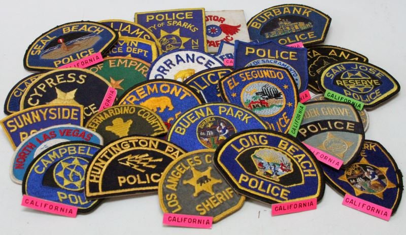 US POLICE VINTAGE PATCH LOT 29 NEVADA & CALIFORNIA: Each patch is from the World Police Museum, Milan, Italy, comes with COA, and all are adhered to a poster board backing, cities include, Campbell, Buena Park, Sunnyside, Los Angeles County, Lee County