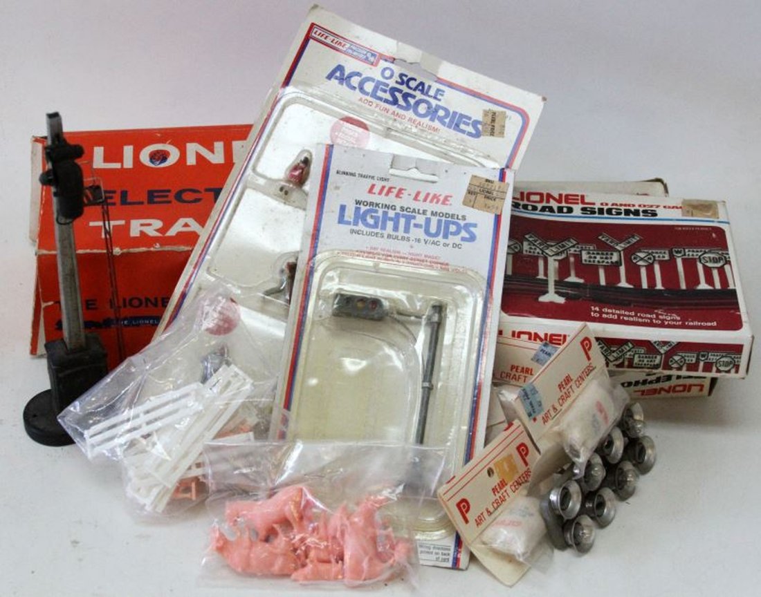 LIONEL TRAIN SIGNS POLES CHARACTERS AND MORE: Includes Lionel O and O27 Gauge Telephone poles, boxed, Lionel Road Signs boxed, Life-Like light ups, in package, Life-Like O scale people, Lionel Trestles boxed, Lionel signal tower.