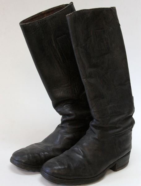 PAIR OF WWII GERMAN ARMY LEATHER JACK BOOTS: Blackened leather Jack Boots with internal boot pulls and hob nails to the soles. Size not marked, sole measures at 11 inches in length 4 inches at the widest point. Worn in, some scuffing, otherwise