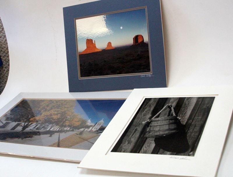 SIGNED LANDSCAPE PHOTOS BOB LILLY RICHARD JOHNSON: Three landscape photos, signed. Includes: two Bob Lilly (NFL player, Dallas Cowboys) digital photographs (one of street and church in New Mexico, one of Monument Valley, AZ with full moon), and one bl