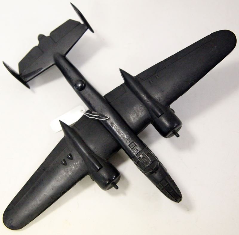 WWII B-25 MITCHELL US ARMY SPOTTER MODEL PLANE: Produced by Cruver dated 7/42. Measures at 9 inches long with a wingspan of 11 inches. Fuselage shows some bubbling otherwise good condition.