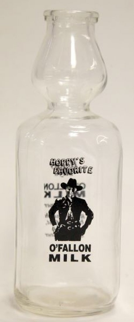 VINTAGE HOPALONG CASSIDY MILK JUG/GLASS/TUMBLER: This lot contains a vintage Hopalong Cassidy glass Milk Jug, a glass tumbler, and seven milk cups. There are 3 black cup designs, 2 red cup and a green cup. Jug measures at 10 inches tall, tumbler at 