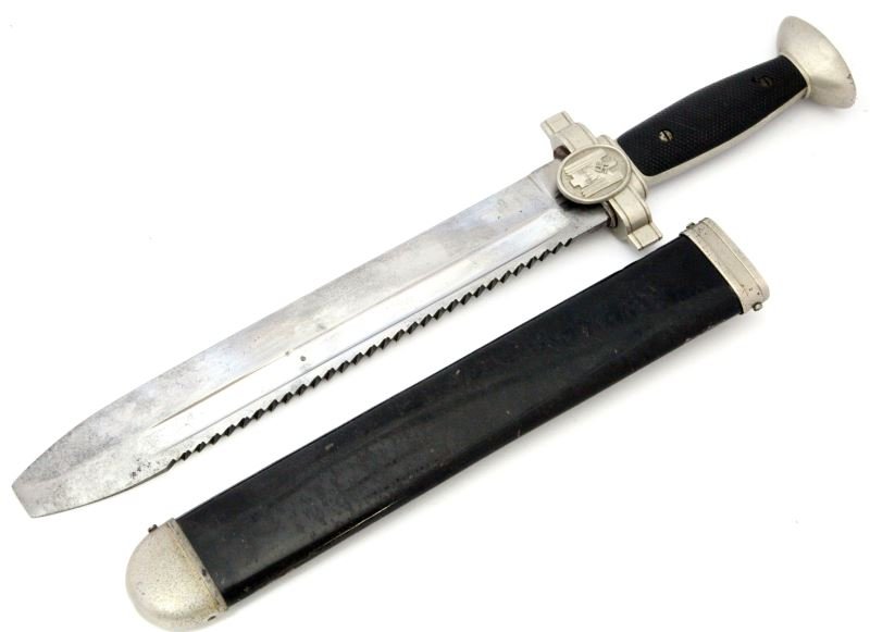 WWII NAZI GERMAN RED CROSS HEWER SAW BLADE DAGGER: Red Cross EM Hewer with no makers mark. Blade is in good to very good condition with some patina. Cross guards, grips and pommel are very good, and leather throat washer is intact. Scabbard has some p