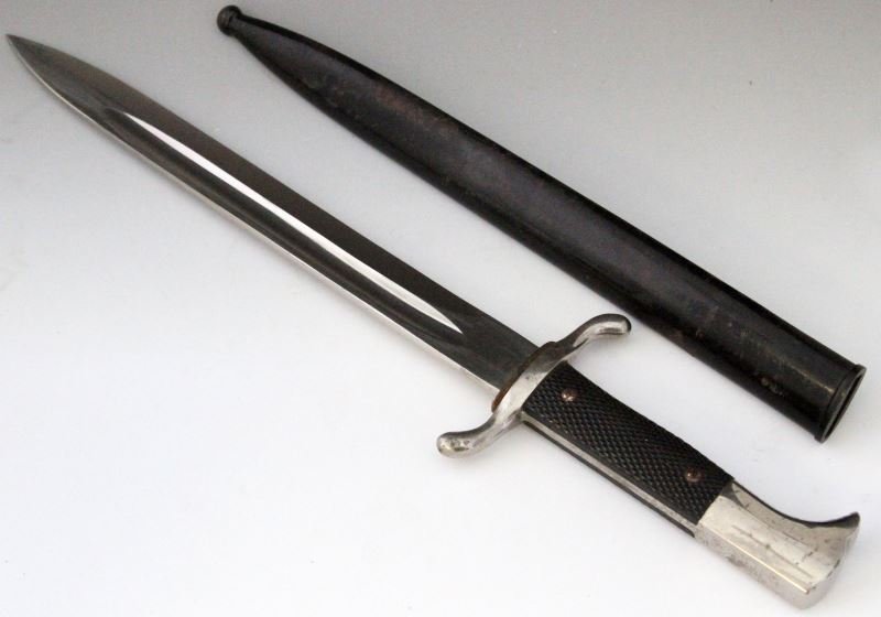 WWII GERMAN PARADE BAYONET BY CARL EICKHORN: Carl Eickhorn stamped blade. Blade is very good to excellent, almost mint. Double cross guard and no rifle groove or lock. Throat washer is 98%. Some minor plating issues to cross guard and handle. Gr