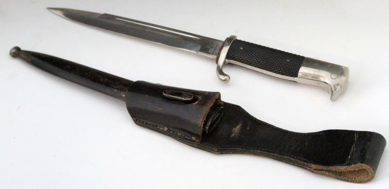 WWII GERMAN FIRE WALKING OUT DRESS PARADE BAYONET: Firemans dress bayonet Made by Rudolf Buchel in Solingen. Blade is 98%, washer is 98%, cross guard shows finish wear from frog. Handle and pommel are 95% with lock having some nicks on high spot. Red 