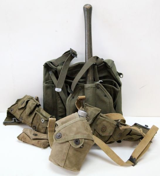 WWII USMC PACK E TOOL BELT W CROSSOVER CANTEEN: USMC stenciled ammo belt , first aid kit, cross over cover and canteen, suspension system, 1941 pattern pack and entrenching tool.