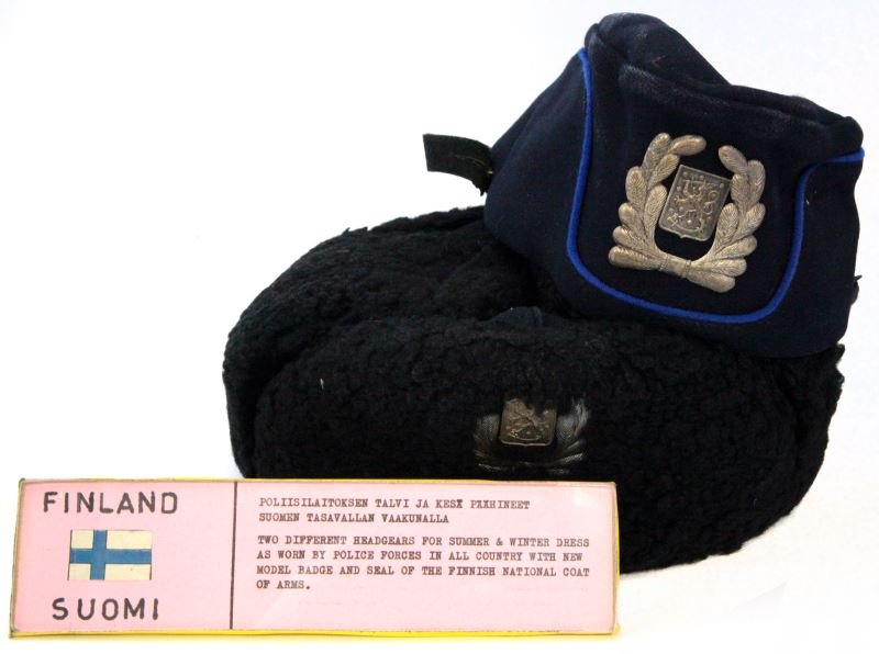 FINLAND POLICE WINTER & SUMMER HAT LOT WITH BADGES: From the collection of the World Police Museum, Milan, Italy, and is accompanied with COA, new model badge, circa 1960's, each very good.