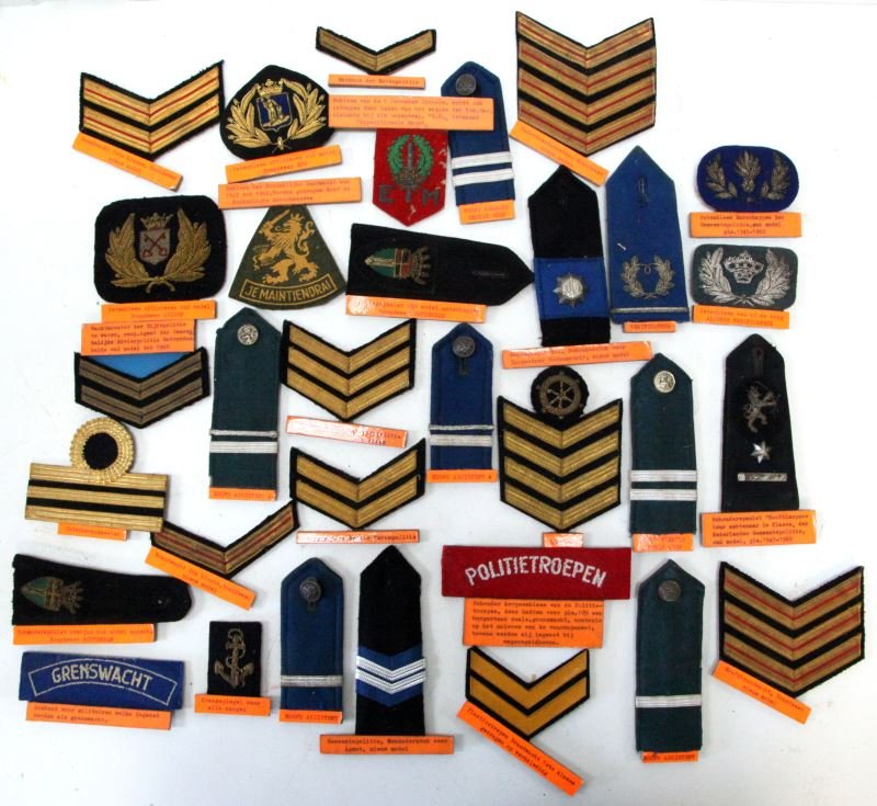VINTAGE DUTCH POLICE EMBLEM PATCHES VARIOUS RANKS: Mixed lot of 32 vintage Dutch police patches. Depicting different branches and different ranks. Some with King's crown, Lion Rampant, and most have description attached. From the World Police Museum i
