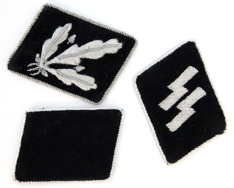 WWII SS COLLAR TABS OBERGRUPFUHRER: Superb construction, no black light reaction, nonetheless not authenticated, NSDAP sticker on reverse of one of the higher ranking tabs.