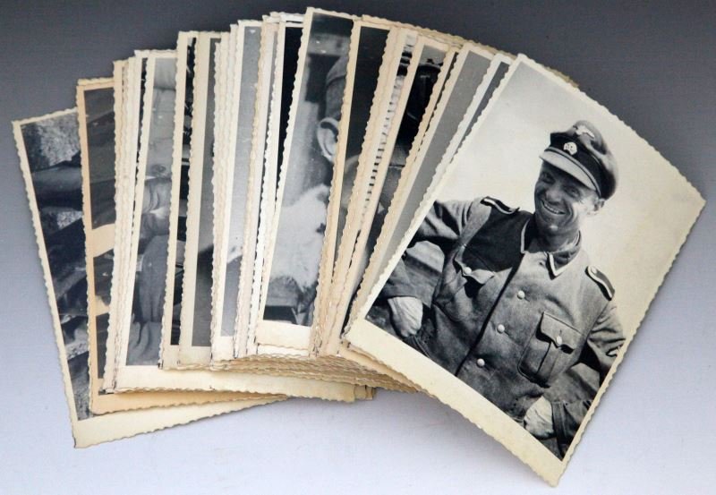 GROUP OF 50 PHOTOS OF SS MEN UKRAINE ARCHIVES: Backs of photographs are stamped "Redeemed". Unauthenticated. Some bending and yellowing present; overall in very good condition. This lot has a reserve.