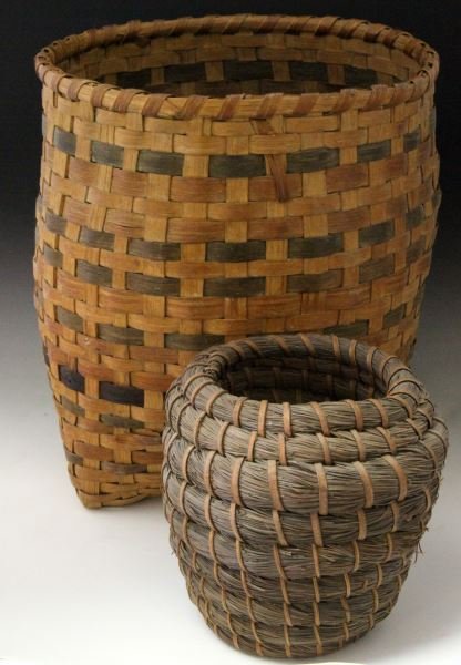 2 NATIVE AMERICAN HAND WOVEN BASKETS PINE AND OAK: Two Native American hand-woven baskets. Includes: a Cherokee Oak basket made by Shosoni West (10.5 inches by 9 inches) and one is a Coushatta Native American Indian Pine Needle basket made by Marian J