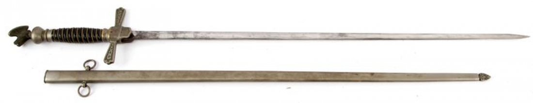 FRATERNAL ORDER SWORD WITH STANDING EAGLE POMMEL: Simple but elegant sword with wire wrapped leather grip and standing eagle pommel. Un-named and plain un-etched elliptical blade. Domestic maker mark under cross guard.