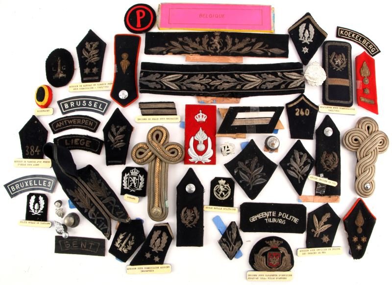 WORLD POLICE BELGIUM COLLECTION PATCHES INSIGNIA: From the World Police Museum in Milan, Italy. Early to middle 1900's. Group includes Early Belgian Police patches, shoulderboards, cap badges and buttons. All with removable rubber or cardboard backin