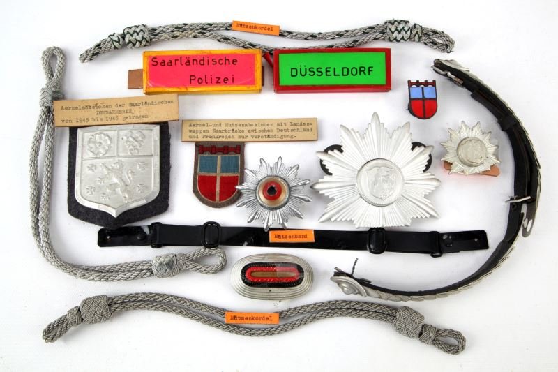 SAARLAND & DUSSELDORF GERMAN POLICE CAP INSIGNIA: Mixture of pre and post war cap insignia and Shako parts, from the World Police Museum, Milan, Italy and is accompanied with COA, all very good with some retaining Museum descriptions.