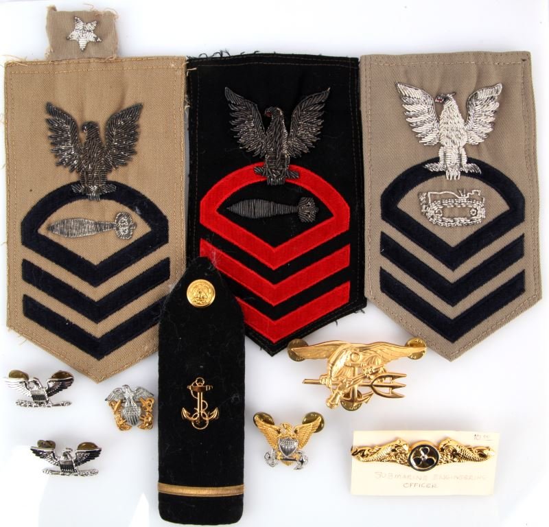 USN INSIGNIA LOT OF TEN WWII TO PRESENT: Including items such as Seal team metal device, Senior Chief shoulder patches with bullion, shoulder board, Submarine Engineer Officer metal device and various eagle devices.