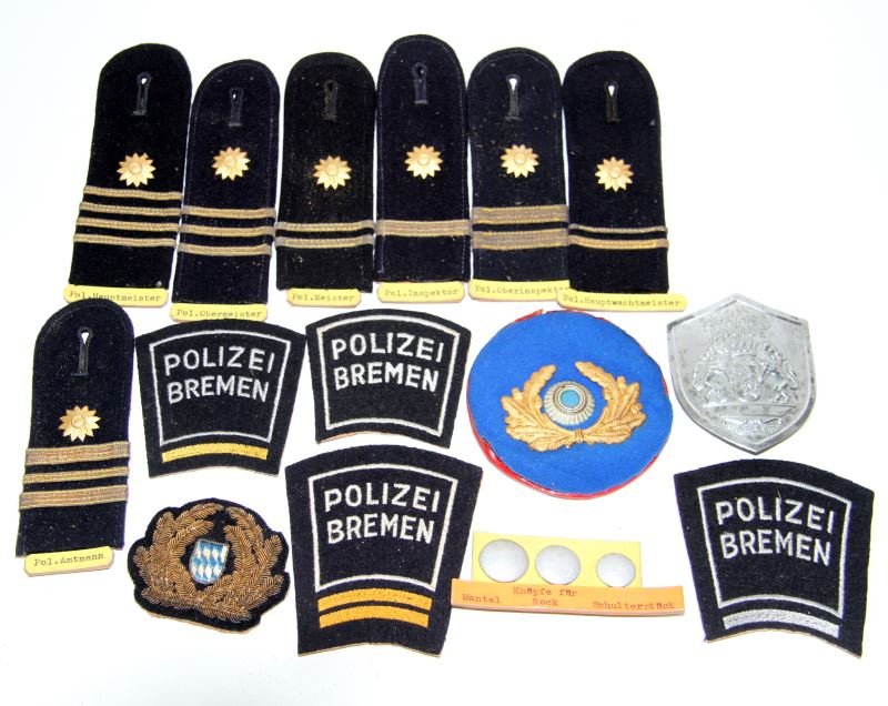 BREMEN GERMANY POLICE BADGE PATCH & SHOULDERSTRAP: Badge, shoulder straps, and patches, circa post war, from the World Police Museum, Milan, Italy and is accompanied with COA, also pieces are affixed with display materials from the museum.