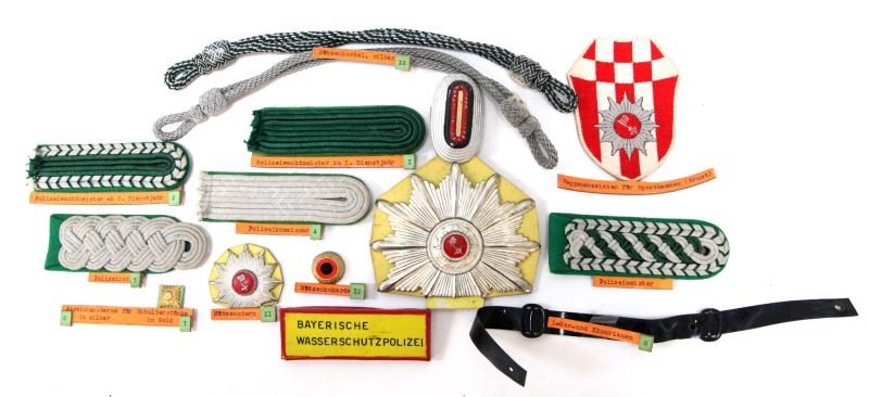 BAVARIA GERMAN STATE POLICE BADGE & PATCH LOT: From the collection of the World Police Museum, Milan Italy and is accompanied by COA, patch Shako Plate, shoulder straps, circa just post war, also visor chin straps and more.
