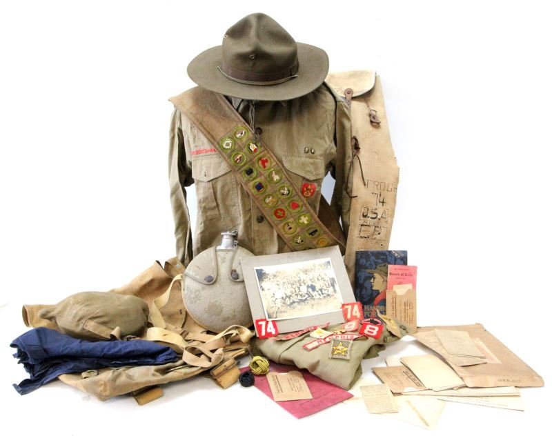 1934 TROOP 74 MEMPHIS BSA BOY SCOUT UNIFORM & MORE: Uniform and a multitude of accoutrements starting with a original photograph of troop 74 all in uniform with clear view of 74 on there shoulders, also includes uniform shirt, trousers, BSA hat, 1912 p