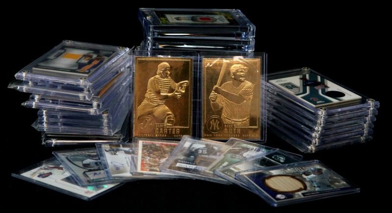 35 MIXED BIG NAME SIGNATURE AND SWATCH SPORT CARDS: Group includes 24 kt plated cards, jersey swatch cards, signature series cards, and big name cards. All cards come in some sort of protective case. Many in 4 screw hard plastic cases. some in thicker 