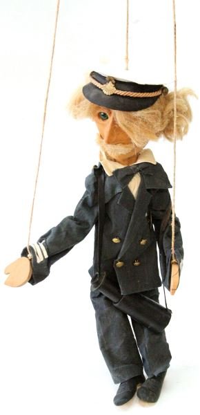 HANDMADE SEA CAPT. MICHELANGELI ORVIETO MARIONETTE: 26 inch tall figure of a Naval Sea Captain. Hand carved wood head, feet and body parts. Bottega Michelangeli Makers label in pant leg. Glass eyes. In very good condition with some hair mussed from sto
