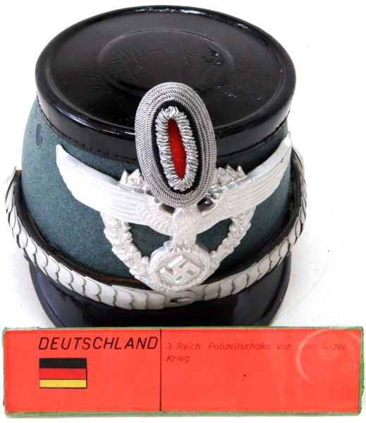 WWII GERMAN THIRD REICH BERLIN SHAKO: Robert Lubstein maker stamped near excellent liner and sweatband, with bullion pom pom, moth free, some fading to the rear visor, overall very good.