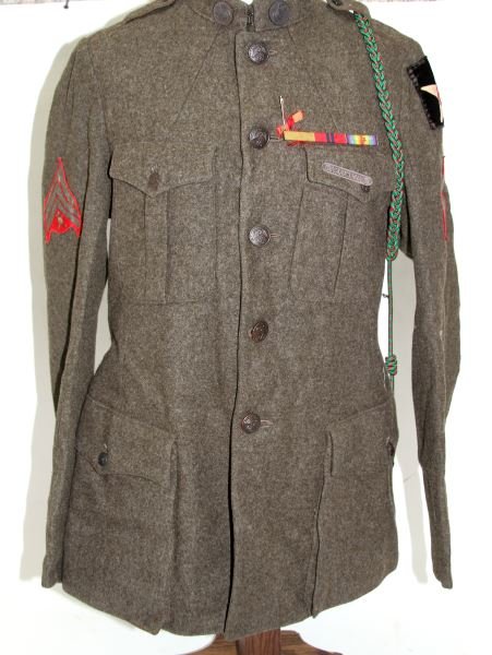 WWI USMC MARINE SECOND INFANTRY DIVISION TUNIC: 2ND I.D. Shoulder patch, EGA collar discs, sterling marksman badge, cord and service stripes, seller states new to the market direct from relatives, not verified by us, moth damage free, very good. Th