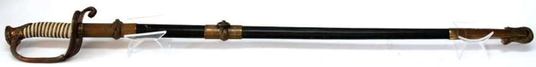 USN MODEL 1851 OFFICERS SWORD MADE BY MEYER USA: Made within the last 50 years by Meyers New York and marked "Made in USA" with makers mark on ricasso. Etched blade is near mint. Overall very good condition with minor marks t leather on scabbard.