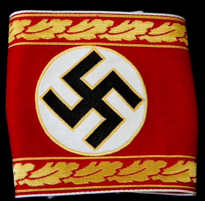 UNSEWN GERMAN NSDAP SUPREME DEPT LEADER ARMBAND: Unfinished armband for NSDAP Supreme Department Leader. RZM tag to back center of attached Swastika. In overall very good condition with some minor soiling.