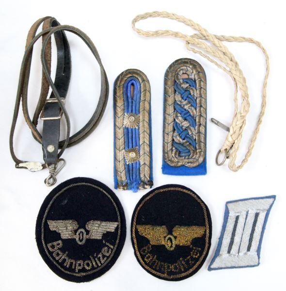 ANTIQUE BAHN GERMANY POLICE PATCH & INSIGNIA LOT: Two early and obsolete bullion patches, two shoulder straps,collar insignia and two police whistle lanyards, these are from the World Police Museum, Milan, Italy and are accompanied with COA.