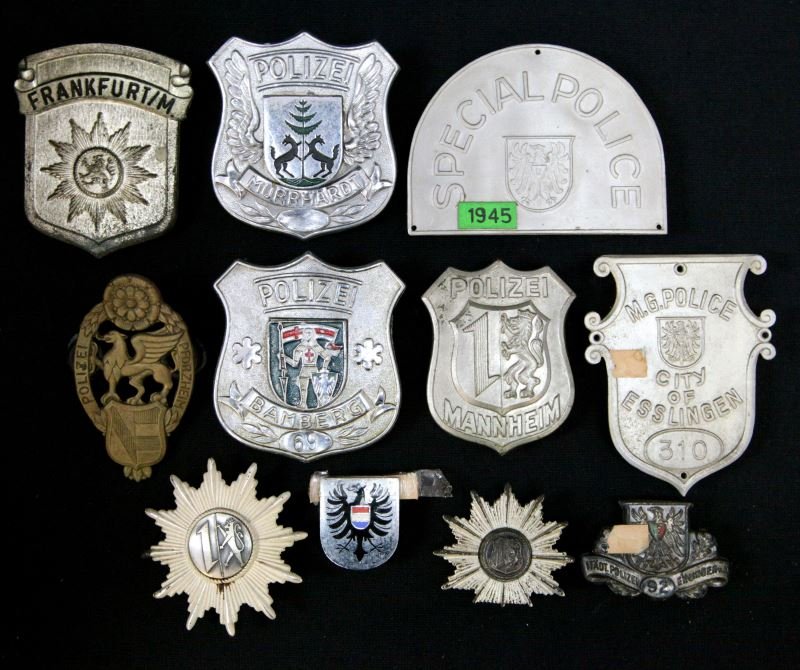 WORLD POLICE MUSEUM COLLECTION OF GERMAN BADGES: Eleven pieces from the Museum, several are 1945 immediate post war, five chest badges the balance cap badges, no duplication, variety of cities, Frankfurt, Mannheim, Esslingen and more.