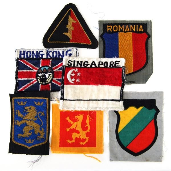 GROUP OF 7 NON-GERMAN SS VOLUNTEER PATCHES: Includes patches from Lithuania, Romania, Singapore, Hong Kong, Norway, Ukraine, and Flemish. Light wear present to patches; overall in very good condition. Unauthenticated.