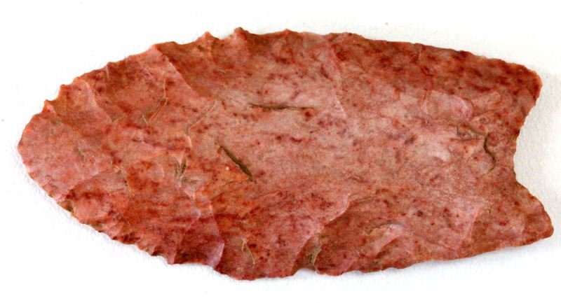 ROSE CHERT ALABAMA PALEO ARROWHEAD: Flute running near the entire length of the point, well crafted from a long time collector dating back to the 1940's and is new to the market. Measuring three inches all the normal indications of auth