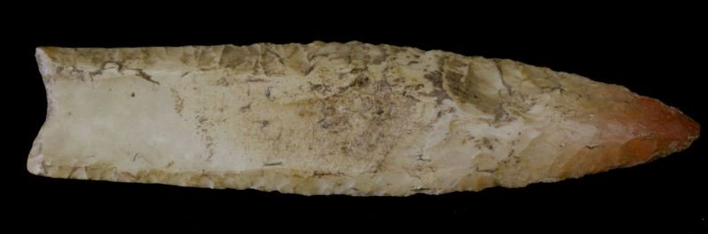 NORTHEAST ALABAMA CLOVIS TYPE PALEO ARROWHEAD: Double sided basal fluted, 4.5 inches in length, complete, although not specifically provenanced, from a long time collector of the region and the patina and chert is atypical.
