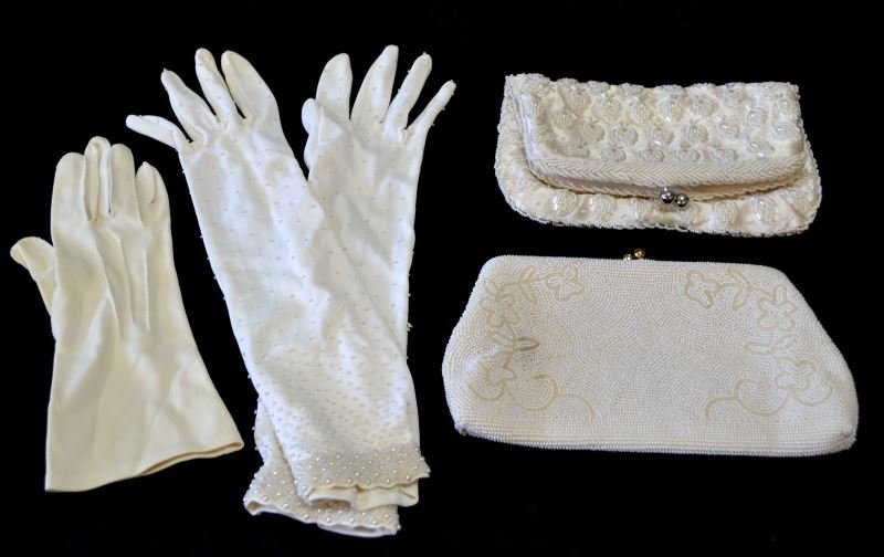 VINTAGE BEADED EVENING HANDBAGS AND GLOVES: Two vintage circa 1950's hand beaded evening clutches. Both bags antique ivory in color with flower ornamentation. Both bags in good condition but do have some staining, clasps snap shut tightly, inte