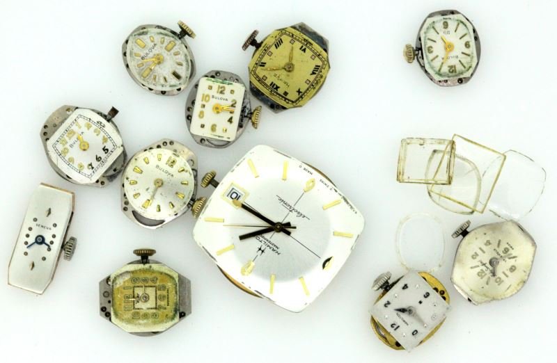 SMALL LOT OF VINTAGE WATCH MOVEMENTS AND CRYSTALS: Ten ladies vintage watch movements, including five Bulova's, plus one each of lady Sanford, Hamilton, Harvel, Wyler and Geneva. Men's movements include Longines Grand Prize automatic, and one Hamilton
