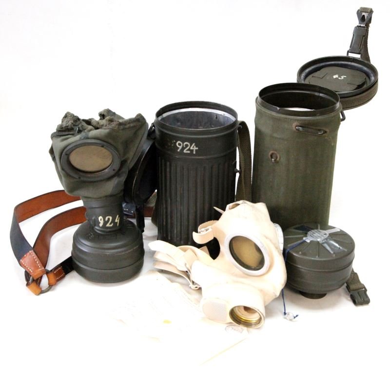 WWII 1937 WAFFENAMT STAMP GAS MASK & 1957 ALSO: Two mask to include very nice condition 1937 canister and 1939 mask both stamped and complete, later1957 mask with OD canvass cover and carry belt.