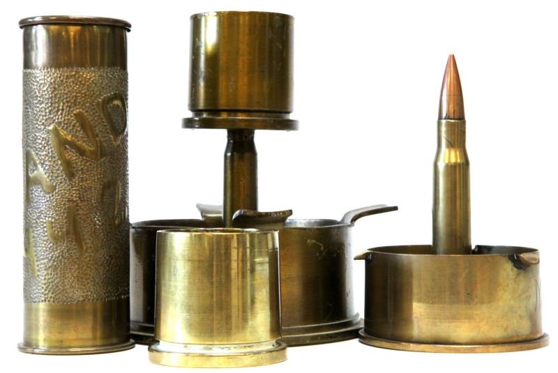 WWII TRENCH ART LOT OF 4 JAPAN ENGLAND ORDNANCE: Includes a Japanese shell ashtray inscribed mundial, 1944 U.S. Flaming Grenade stamped 90MM shell candle holder, and a AEF England stamped 37mm., and a 40mm 1942 MKI.
