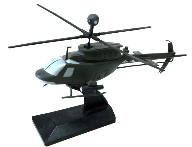 DESKTOP BELL OH-58D AIRCRAFT MODEL KIOWA WARRIOR: Desktop model aircraft. Bell OH-58D "Kiowa Warrior". Measures 14 by 9.5 by 9 inches. Army green, sits on back plastic stand. Very good condition.